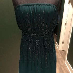 Strapless hunter green dress with shimmering details
